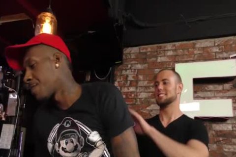 dark men Sharing The Bartender At A Pub