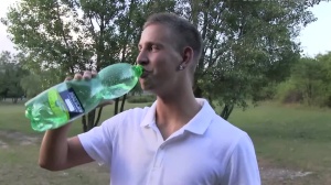 A young guy sucks ramrod in the park