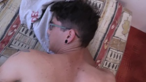 A nice-looking boy takes his raiment off